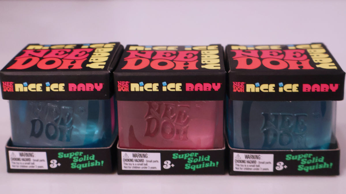 Three packages of Nee Doe Nice Ice Baby Super Solid Squishy toy dough arranged side by side on a plain light background. The boxes show three different translucent colors: blue, pink, and dark teal, with bold red and yellow 'Nee Doe' branding on the top.