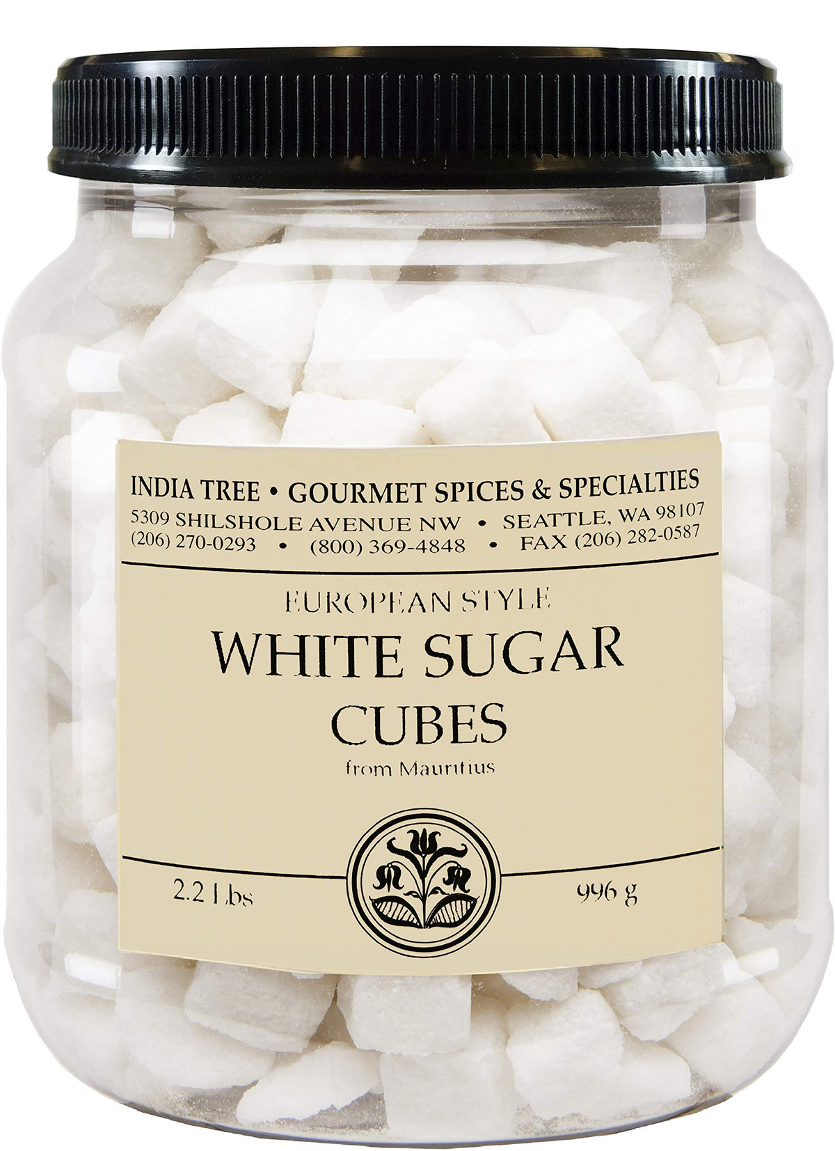 A clear plastic jar filled with white sugar cubes, topped with a black ribbed lid and a cream-colored label reading 'White Sugar Cubes' with the brand 'India Tree Gourmet Spices & Specialties'.