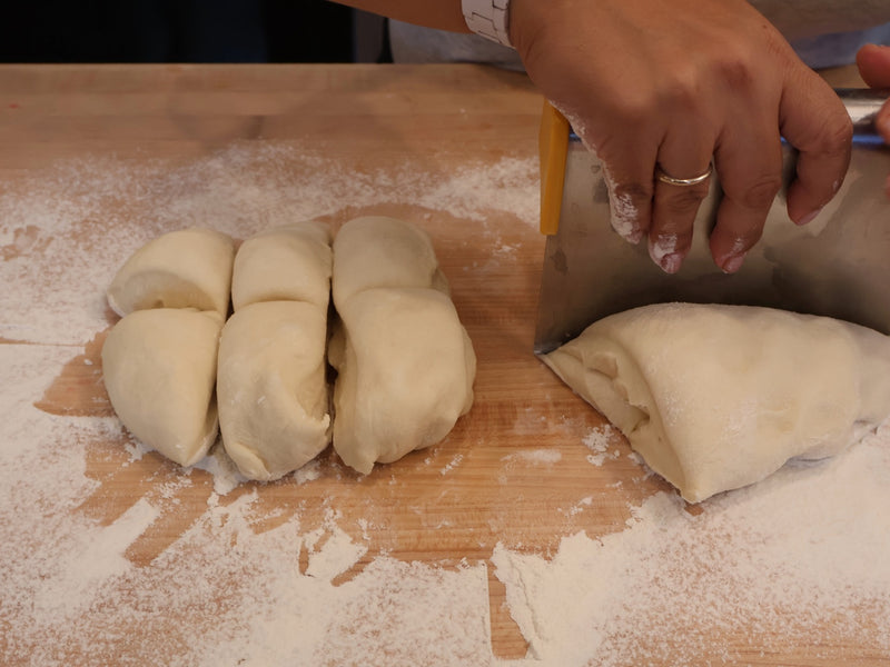 Portioned bun dough on a work surface