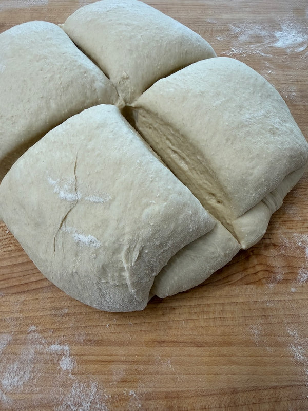 Dough divided into four pieces before shaping