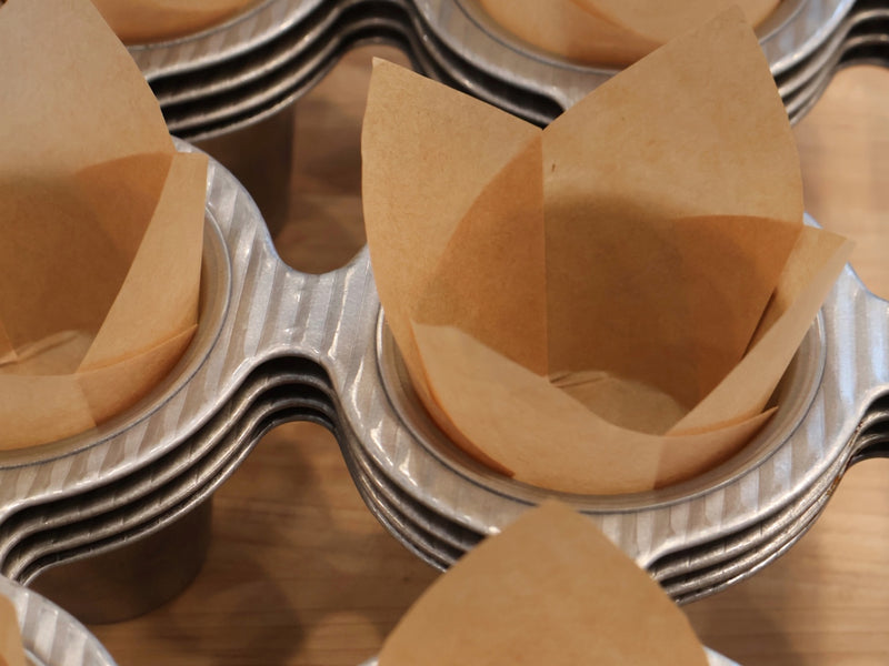 Freshly baked banana muffins cooling on a rack