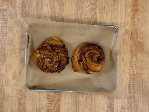 Two swirls baked in a parchment-lined pan