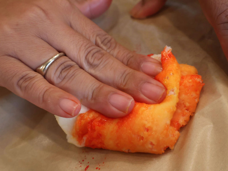 Colorful homemade candy corn dough during shaping