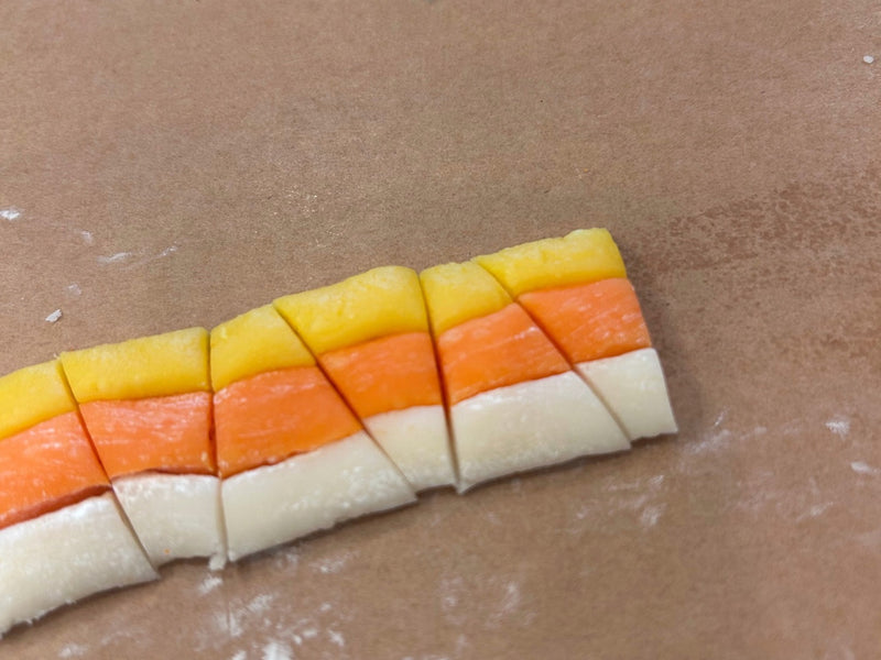 Finished homemade candy corn pieces arranged in rows