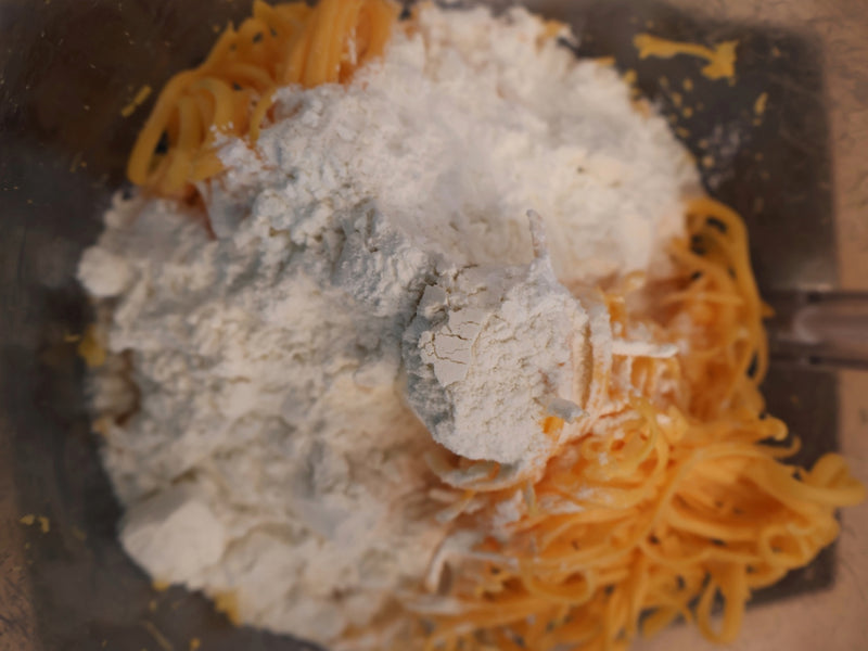 Homemade cheddar cracker dough prepared for its refrigerator rest