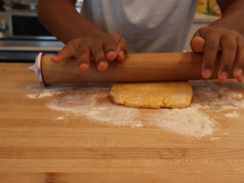 Small homemade cheddar cracker squares arranged before baking