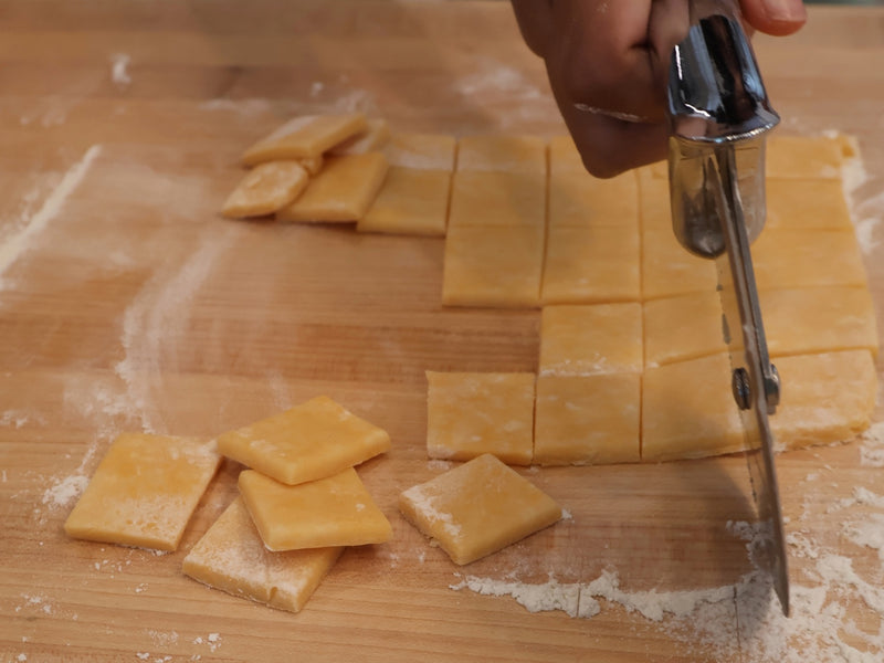 Homemade cheddar cheese crackers baking until crisp and golden