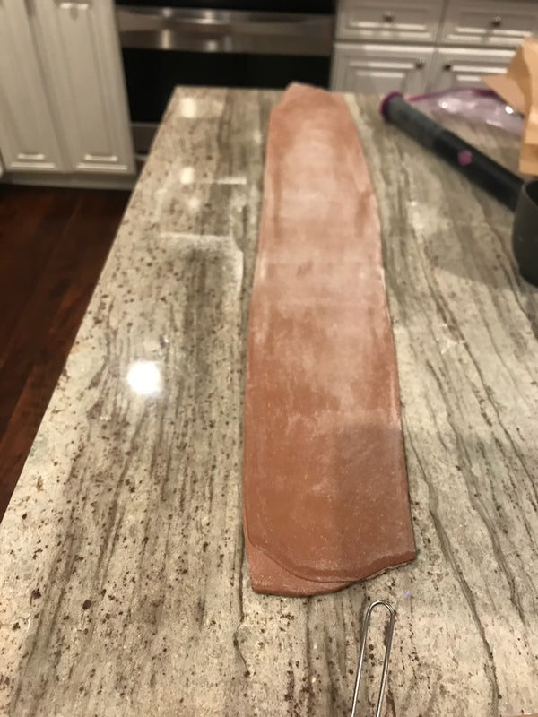 Dough rolled into a long, thin sheet