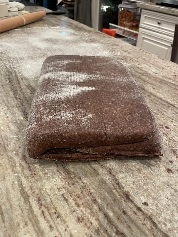 Folded into a block and dusted with flour