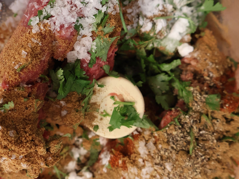 Ingredients prepared for juicy oven-baked kebabs and flatbread