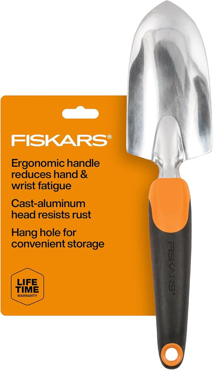 Fiskars garden trowel with orange handle and black grip on a white background
