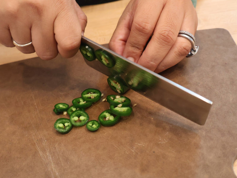 Fresh jalapeños being prepared for jalapeño cheddar biscuits