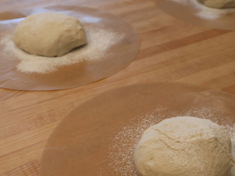 Close-up of stretched pizza dough