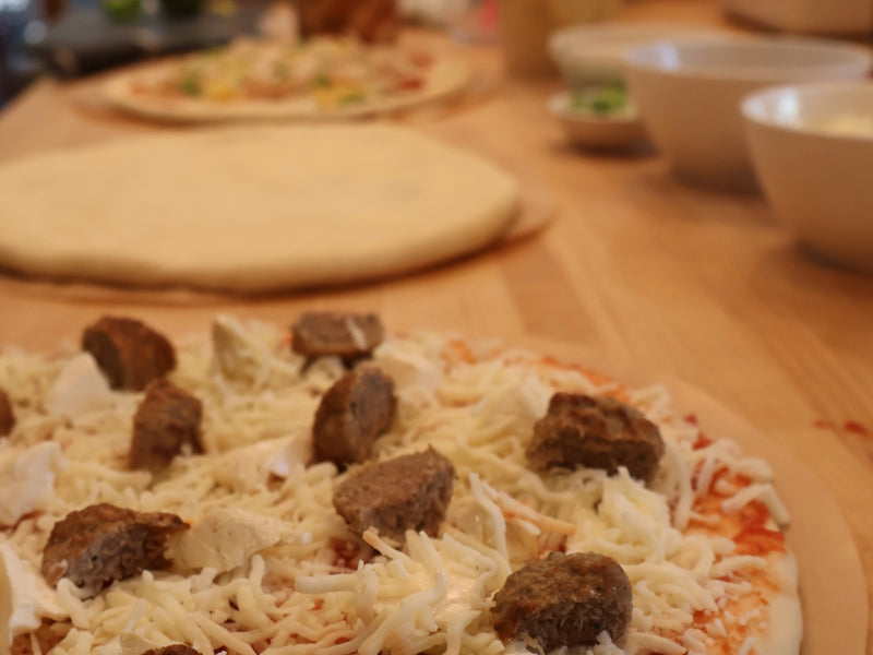 Pantry staples and toppings set out for pizza night
