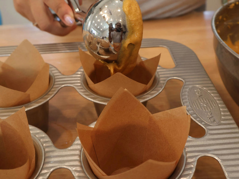 Pumpkin muffin batter portioned for baking