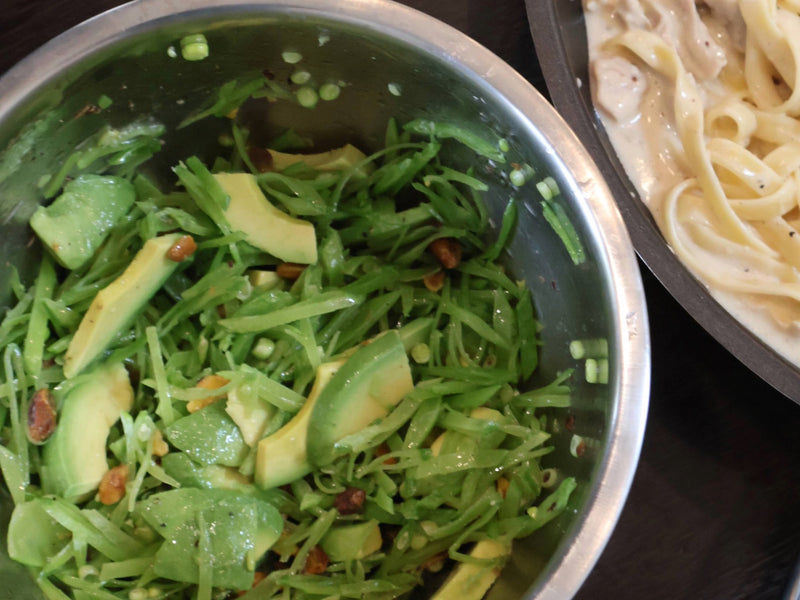 Finished snow pea salad with avocado ready to serve